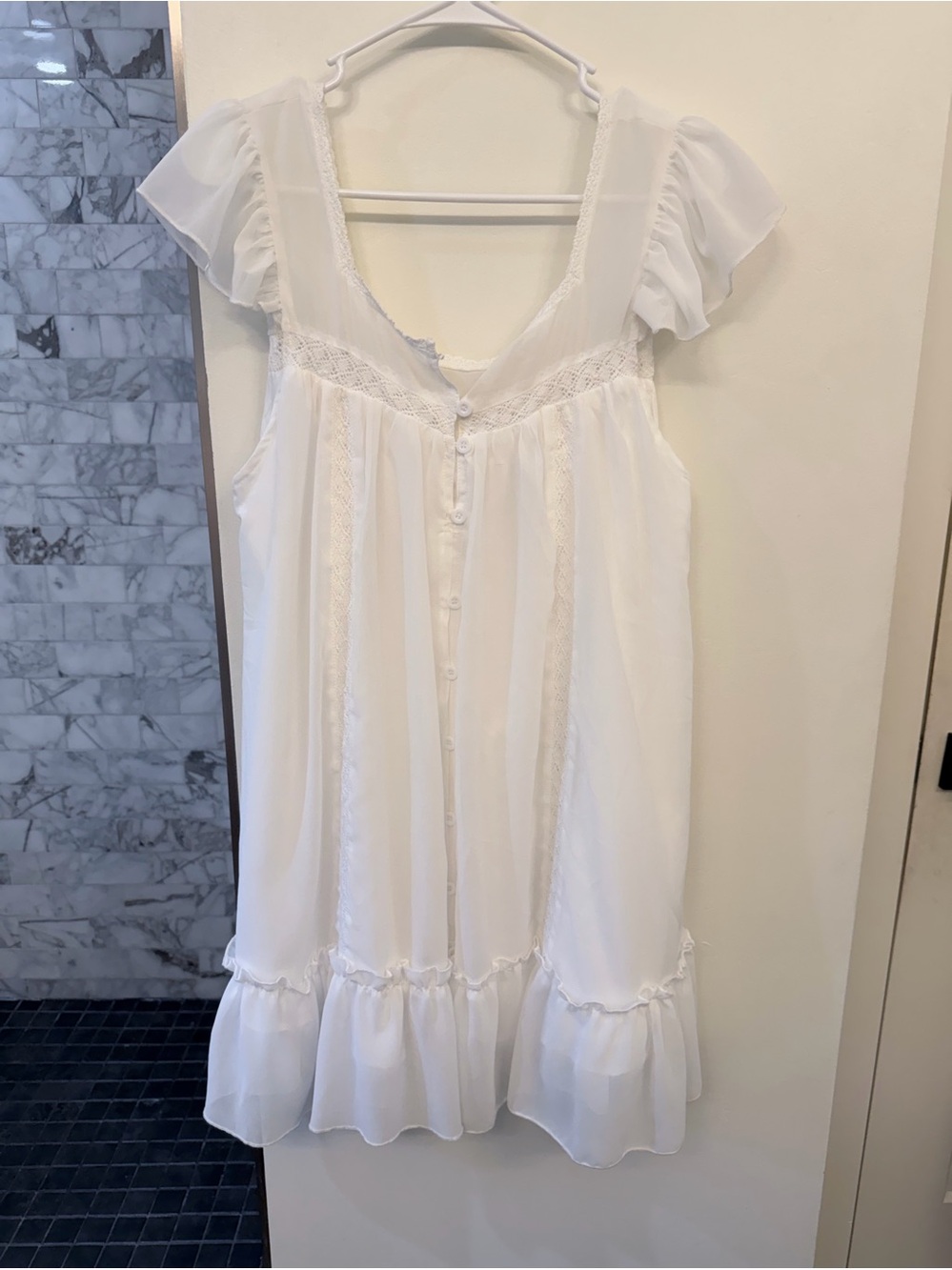 White Dress with Flutter Sleeves, Front Buttons, and Delicate Lace Detailing